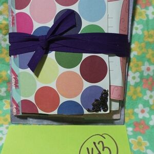 Colorful Polka Dot Notebook with Purple Ribbon
